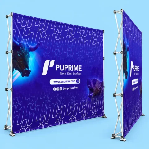 Pop-Up Banner With Stand - 3x3 & 3x4 Grid Stand. Front and side angle view of a collapsible pop up display banner stand featuring a printed blue fabric backdrop set on an expandable aluminum frame.