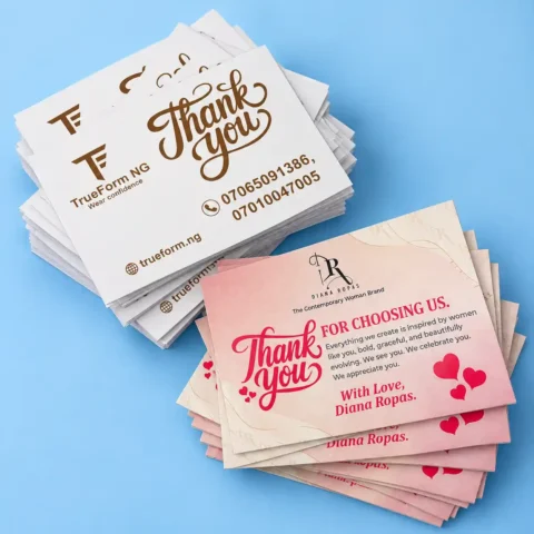 Thank You Card - 4x6in Stack of printed business thank you cards displayed on a light blue background, showing custom text, logos, and contact details.